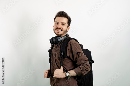 Happy casual man wearing casual clothes posing isolated over white background posing education in high school university college concept.