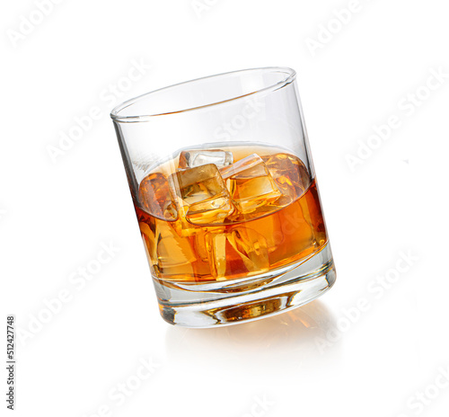 whiskey glass with ice on white
