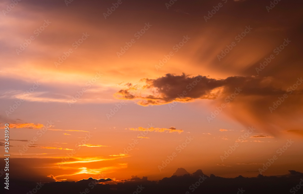 Dramatic orange sunset sky. Beautiful textural background of the sunset and clouds...