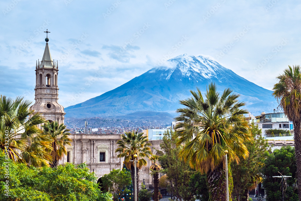 Tower on the background of a volcano in Arequipa, Peru. - obrazy, fototapety, plakaty 