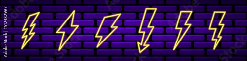 Neon yellow lightning bolts set. Glowing electrical flashes with geometric curves high voltage hazard and powerful vector thunderstorm discharges.