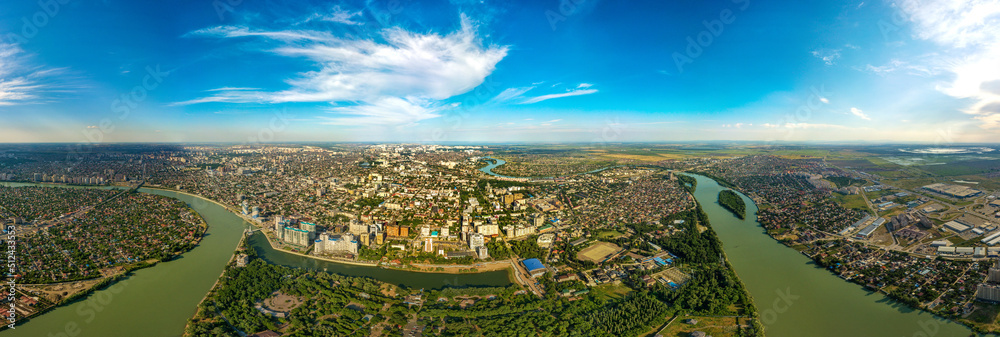 aerial panorama view of the central part of the city of Krasnodar (South of Russia) in the area of Kubanonaberezhnaya street and the Kuban river on a sunny summer day