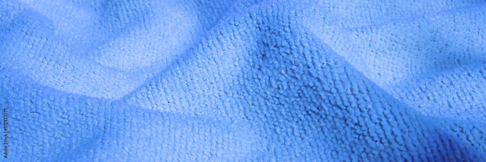 Bright, blue, fluffy, light blanket. Texture textile background Bright, blue, fluffy, light blanket. Texture textile background