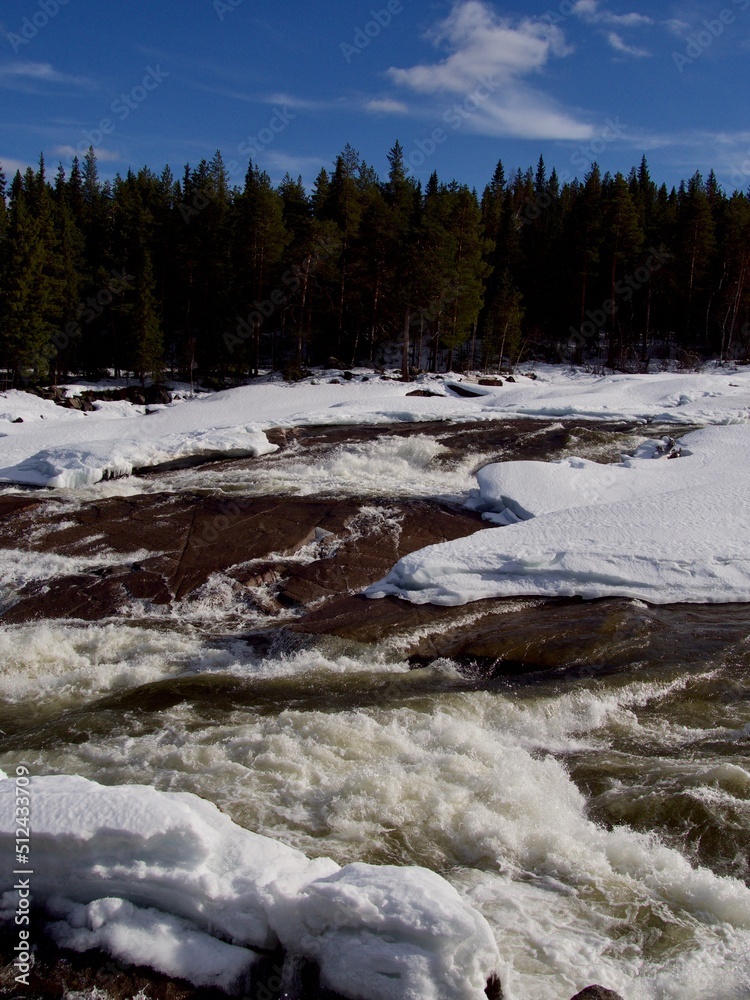 Storforsen, waterfall in Scandinavia in winter Storforsen, waterfall in Scandinavia in winter