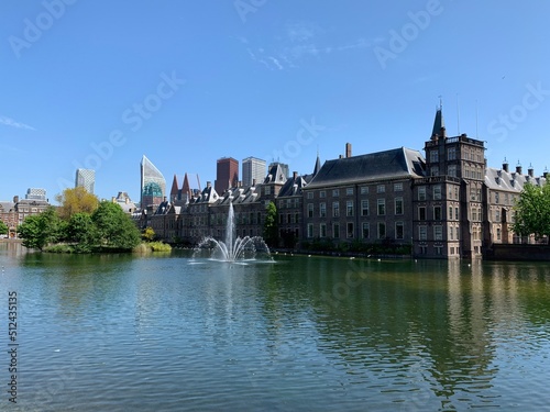 The Hague's Binnenhof with the Hofvijver. Dutch Senate and House of Representatives (Parliament) building with running fountain in the pond at the front.