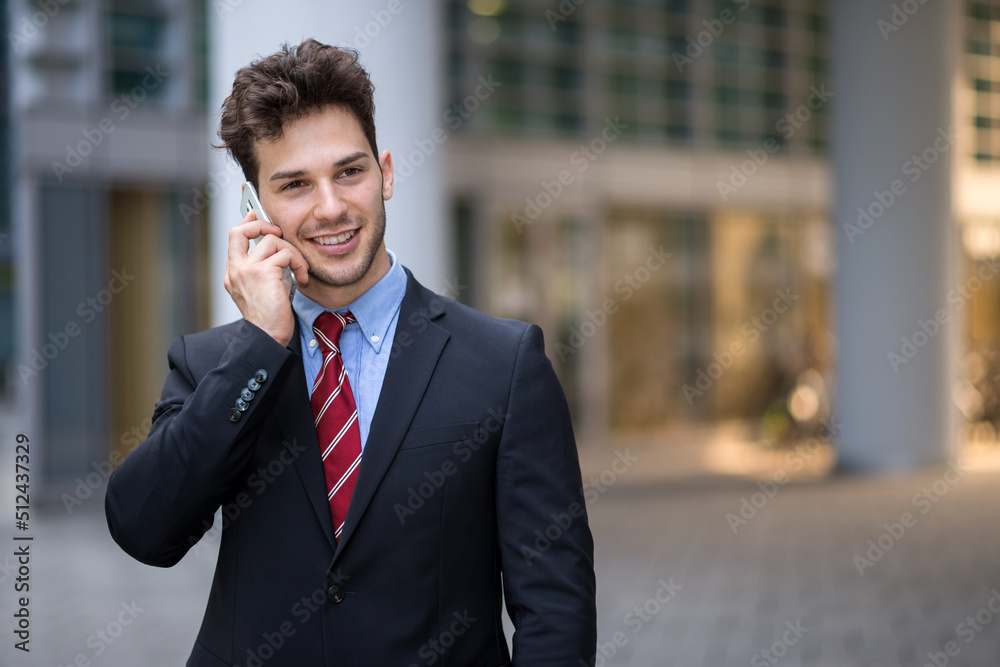 Portrait of a businessman talking on the phone Portrait of a businessman talking on the phone