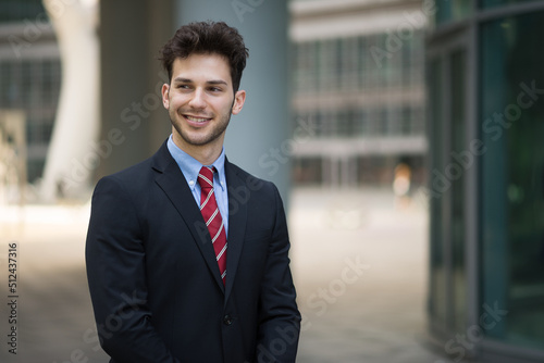 Portrait of an handsome businessman in a business environment