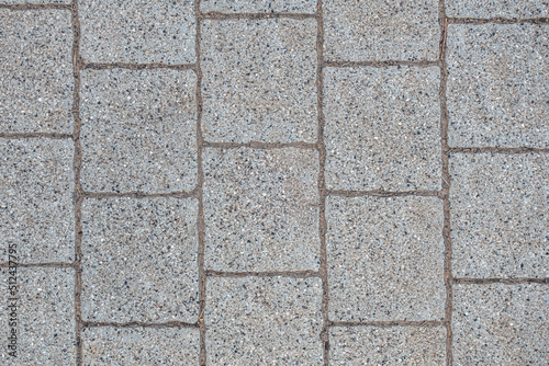 abstract background of an old tiles on the track in the park close up