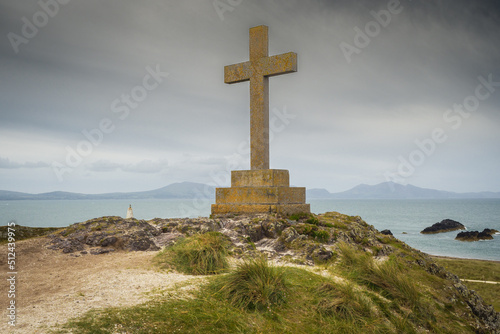 The modern Celtic cross on Llanddwyn Island commemorates the death of St Dwynwen in the year 465