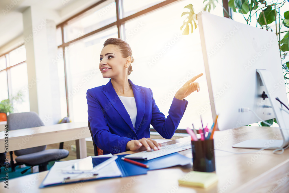 Beautiful business woman in the interior in the process of work
Beautiful business woman in the interior in the process of work