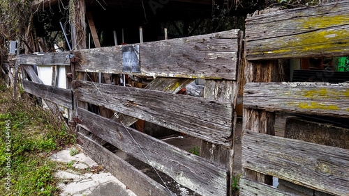 Old Dry Wooden Fence Around a Barn