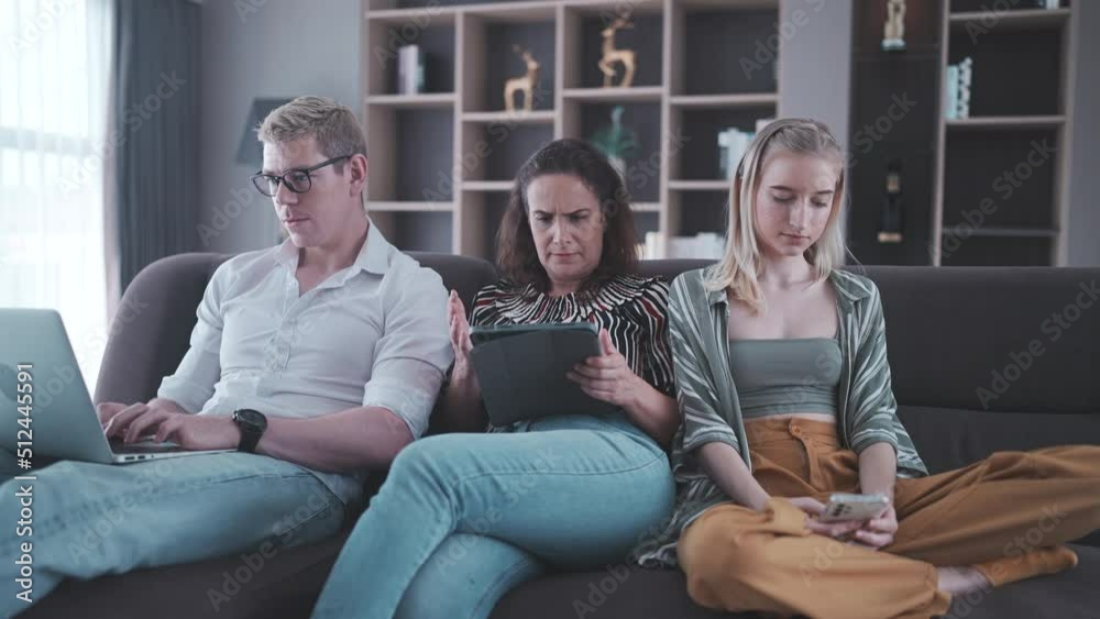 remote working in business work from home, family who father and mother sitting on sofa by looking laptop computer, teenage daughter come together remote working in business work from home, family who father and mother sitting on sofa by looking laptop computer, teenage daughter come together
