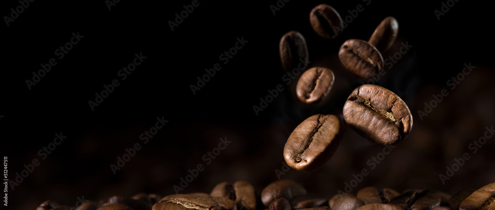 Fototapeta premium Brown Roasted Coffee Beans Close- up On Dark Background. 