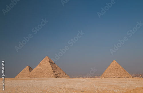 a tourist man looks at the Egyptian pyramids