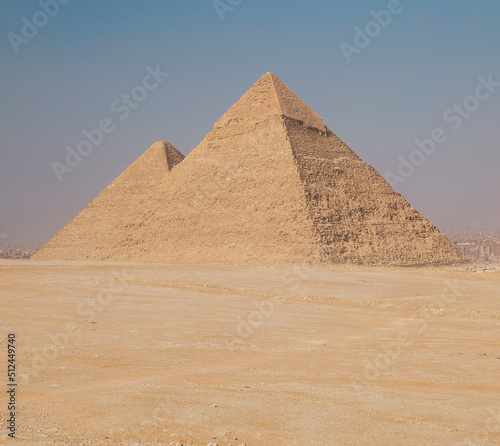 a tourist man looks at the Egyptian pyramids