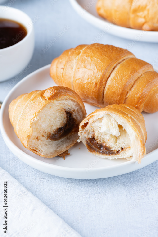A freshly baked French Croissant and coffee
