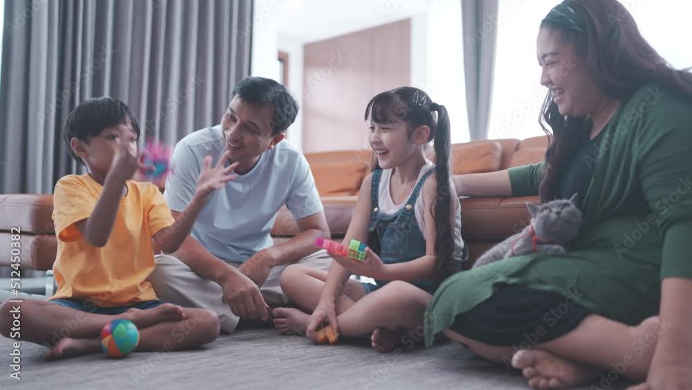 child happy to play a toy game and having fun with asian family at home, wood block education from mother and father together, childhood lifestyle playing for life skill development, enjoying kid care child happy to play a toy game and having fun with asian family at home, wood block education from mother and father together, childhood lifestyle playing for life skill development, enjoying kid care