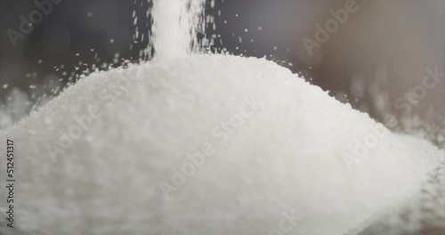 Sugar falls on a mountain of sugar