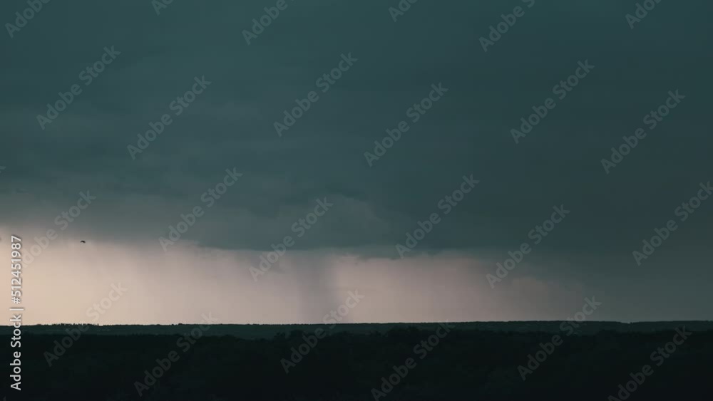 Lightning flash in storm clouds. Heavy clouds bring multiple flashes of