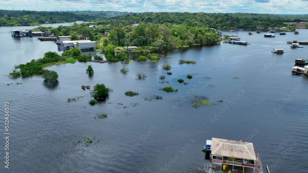 Floating restaurants of Amazon River at Amazon Forest. Manaus Brazil. Nature wild life landscape. Green background. Forest trees at Amazonas state. Tourism attraction. Travel destination. Floating restaurants of Amazon River at Amazon Forest. Manaus Brazil. Nature wild life landscape. Green background. Forest trees at Amazonas state. Tourism attraction. Travel destination.