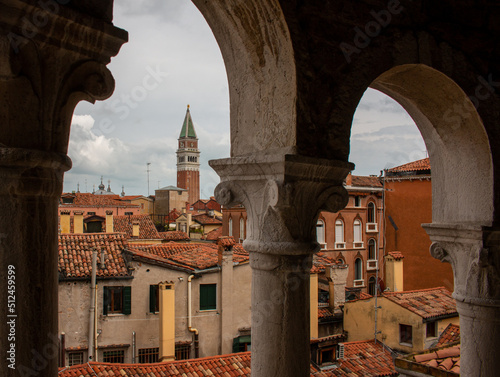 The view of Venetian roofs and Campanile di San Marco from the staircase of Scala Contarini del Bovolo, Venice, Italy photo