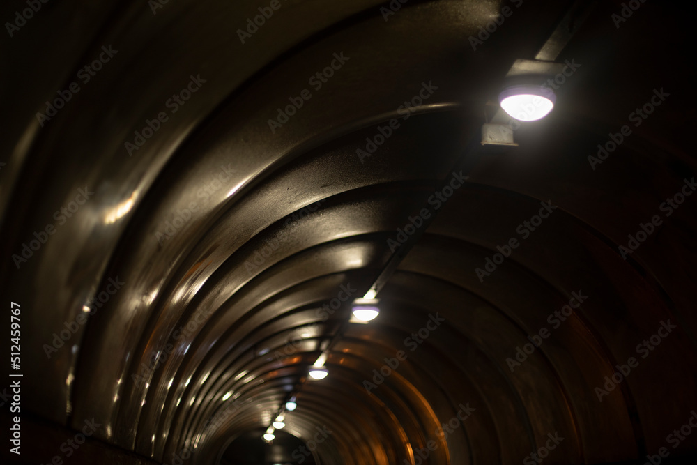 Light of lamp in tunnel. Tunnel at night. Reflection of light on plastic.