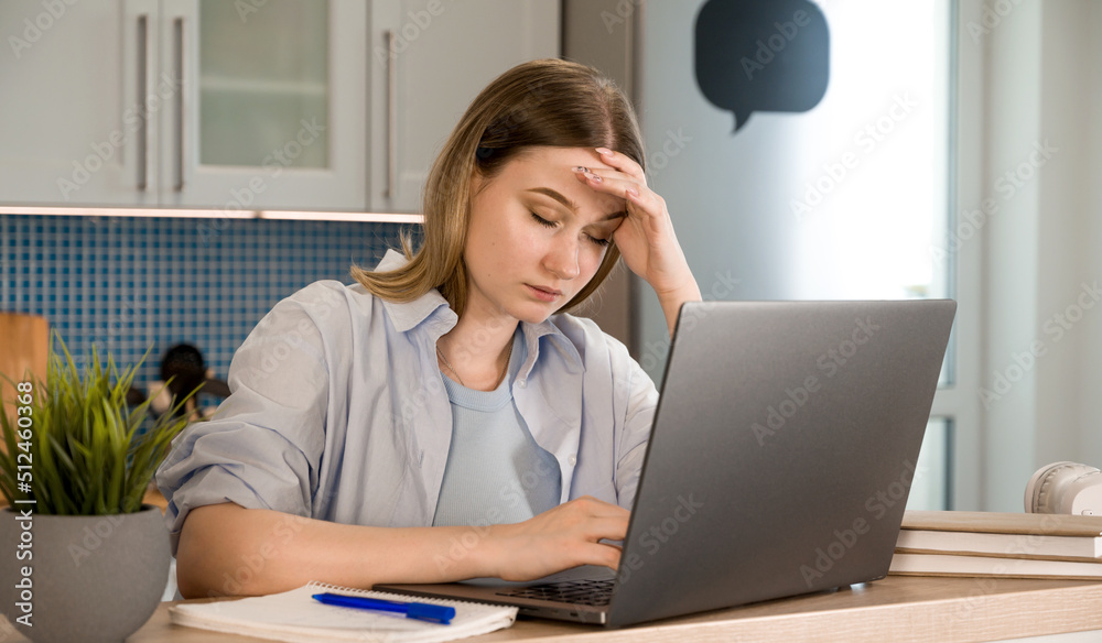 Closeup of a tired female with headache.Burnout at work or college Closeup of a tired female with headache.Burnout at work or college