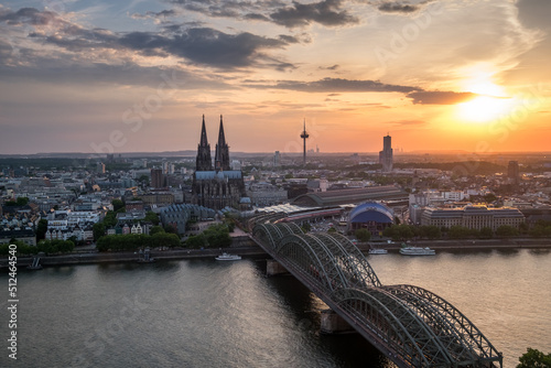 Aerial view of Cologne Cathedral and Hohenzollern Bridge at sunset, Germany