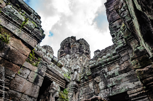 A sandstone carving depicting a person's face atop a pagoda in Bayon Temple in Angkor Thom, Siem Reap, Cambodia.