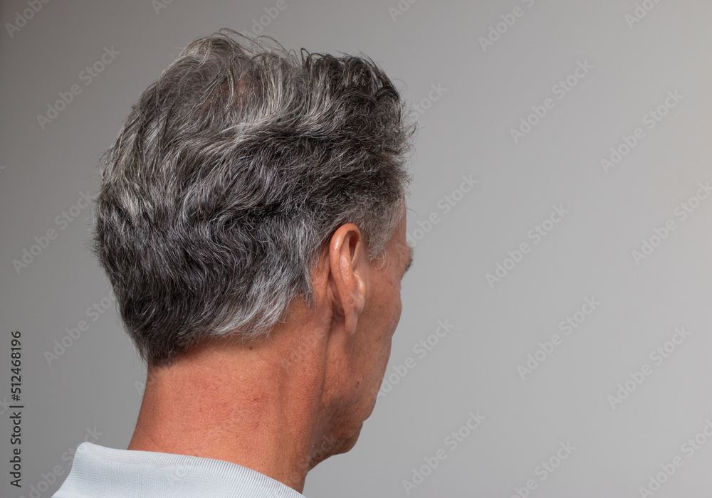 Mature man with salt and pepper hair starting to turn gray