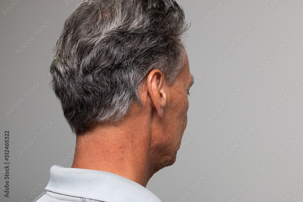 Obraz premium Mature man with salt and pepper hair starting to turn gray