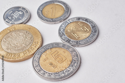 Mexican money, Mexican pesos bills and coins on white background