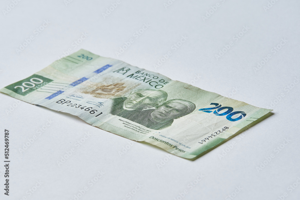 Mexican money, Mexican pesos bills and coins on white background Mexican money, Mexican pesos bills and coins on white background