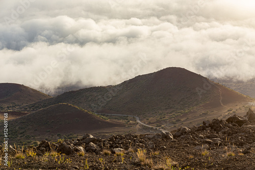 Beautiful sunset of Mauna Kea, red rocks, clouds in Big Island, Hawaii photo