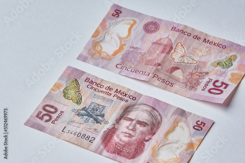 Mexican money, Mexican pesos bills and coins on white background