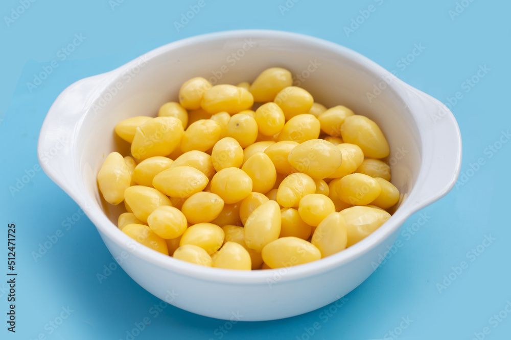Boiled ginkgo nuts on blue background. Boiled ginkgo nuts on blue background.