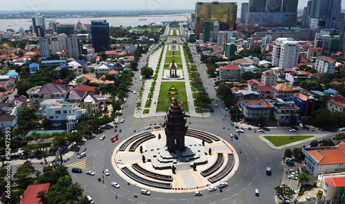 Aerial view of Independence Monument, bottom, and the King Norodom Sihanouk memorial in Phnom Penh, Cambodia. The Mekong river is seen in the background. photo