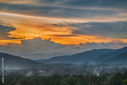 a city town and trees taken from hill at sunset in Malili, Luwu timur Indonesia photo