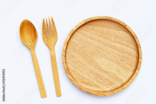 Wooden plate with spoon and fork