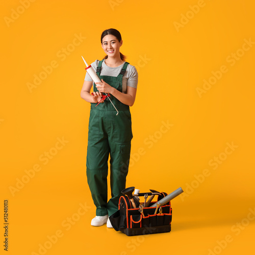 Asian female plumber with t...