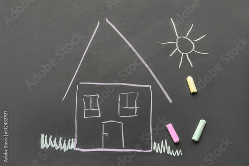 Drawn house and sun with ch...