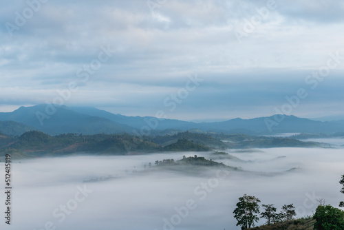 Fototapeta Naklejka Na Ścianę i Meble -  misty landscape in the morning surrounded by mountains Sea of ​​mist at Doi Ti Doo Nan, Thailand
Nan Thailand tourist attractions , Doi tee doo