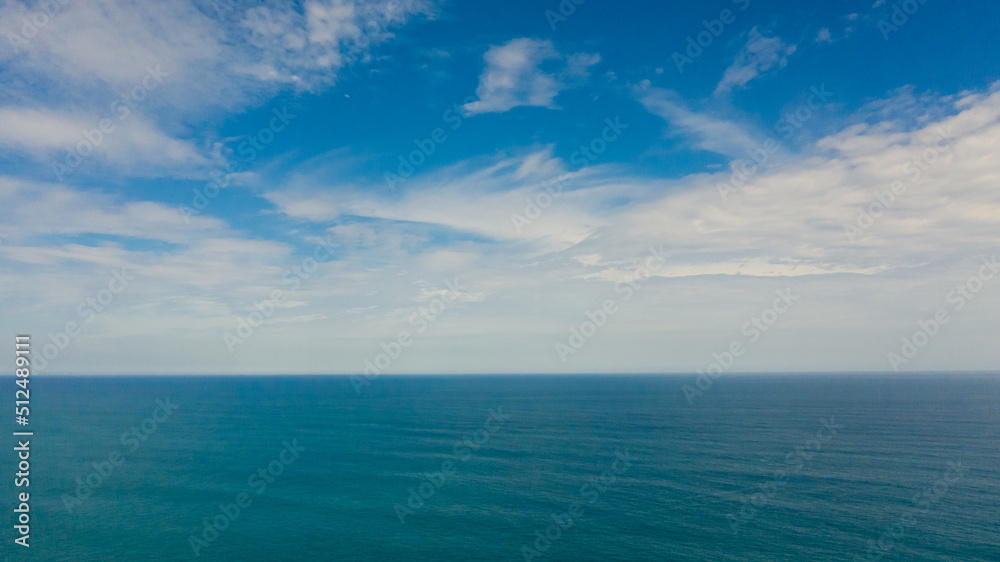 Aerial view of Blue sea with waves and sky with clouds. Ocean skyline. Aerial view of Blue sea with waves and sky with clouds. Ocean skyline.