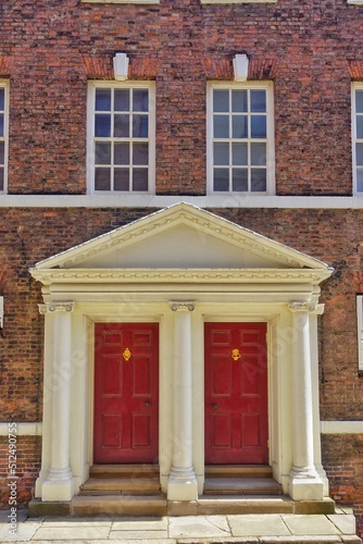 Valokuvatapetti Two Red Georgian Doorways and windows house frontage