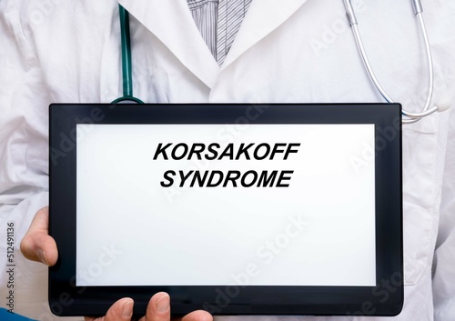 Korsakoff Syndrome.  Doctor with rare or orphan disease text on tablet screen Korsakoff Syndrome photo