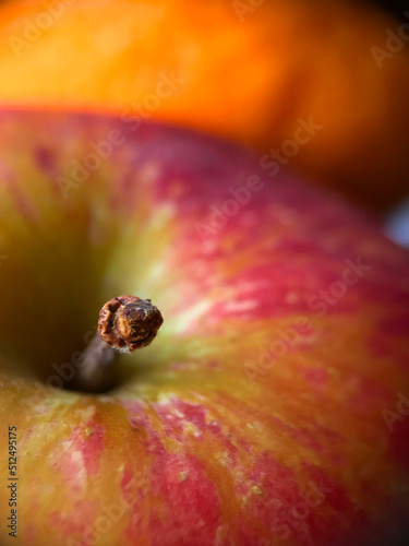 Closeup of healthy red apple with wooden stem