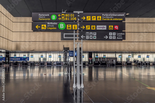 Barcelona, Spain - November 24, 2021: Information board inside Josep Tarradellas Barcelona-El Prat Airport. Modern way signpost with icons on the background of ticket offices