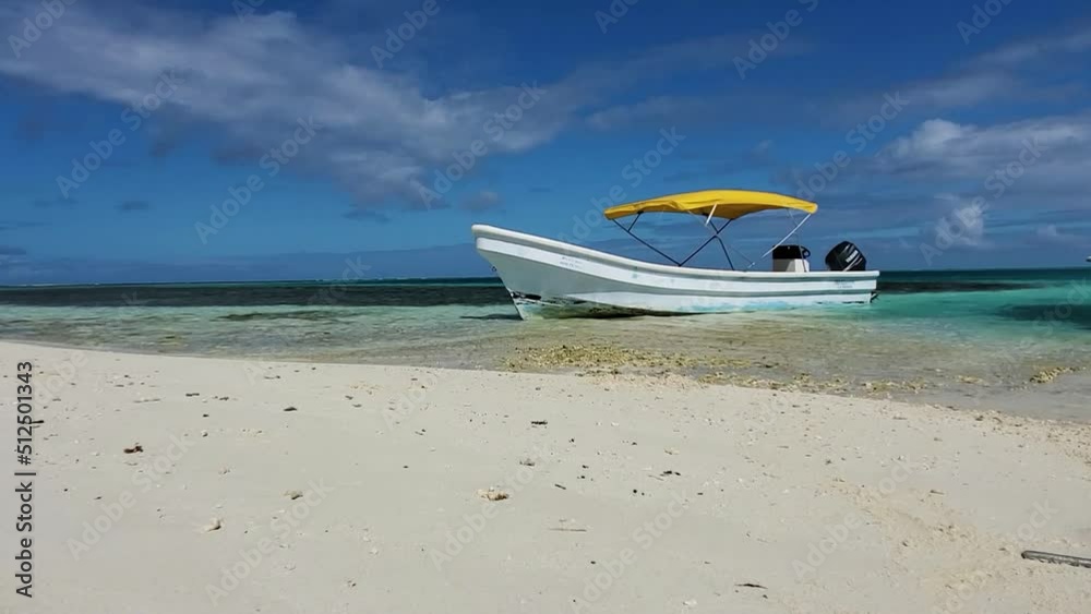 ARTISANAL FISHING MOTOR BOAT MOORED AT CARIBBEAN WHITE sand BEACH detail IN CARIBBEAN sandbank
ARTISANAL FISHING MOTOR BOAT MOORED AT CARIBBEAN WHITE sand BEACH detail IN CARIBBEAN sandbank
