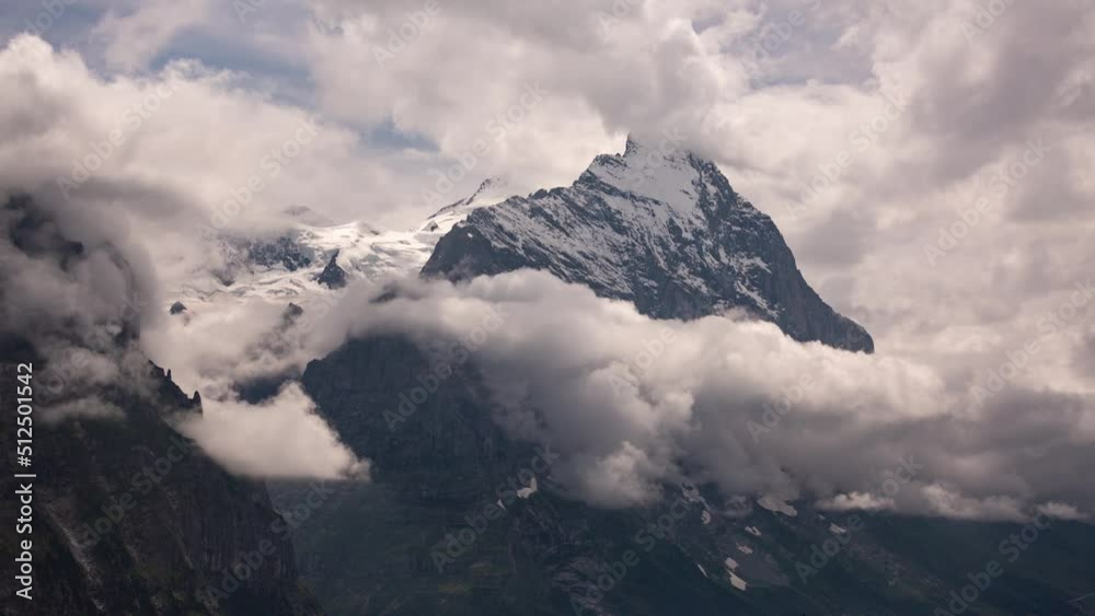 Timelapse of dynamic cumulus clouds in front of moench and eiger north face in Swiss Alps Timelapse of dynamic cumulus clouds in front of moench and eiger north face in Swiss Alps