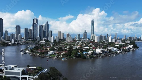 Unique aerial view of popular real estate canal property close to the towering Gold Coast Australia skyline. photo